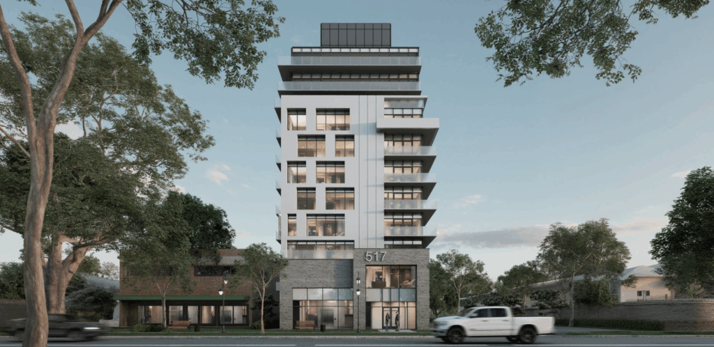 A modern mid-rise apartment building with glass balconies and the number 517 on the facade, surrounded by trees and a white pickup truck driving by in the foreground.